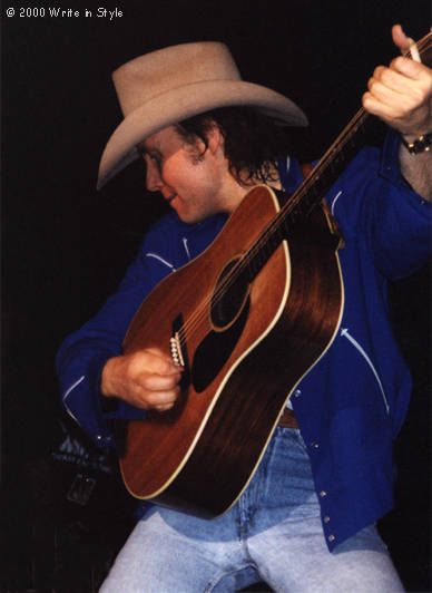 He strummed his guitar like a madman during the acoustic set.